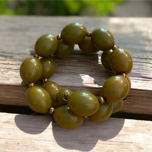 Vintage Bakelite snake bracelet olive colored plastic beads